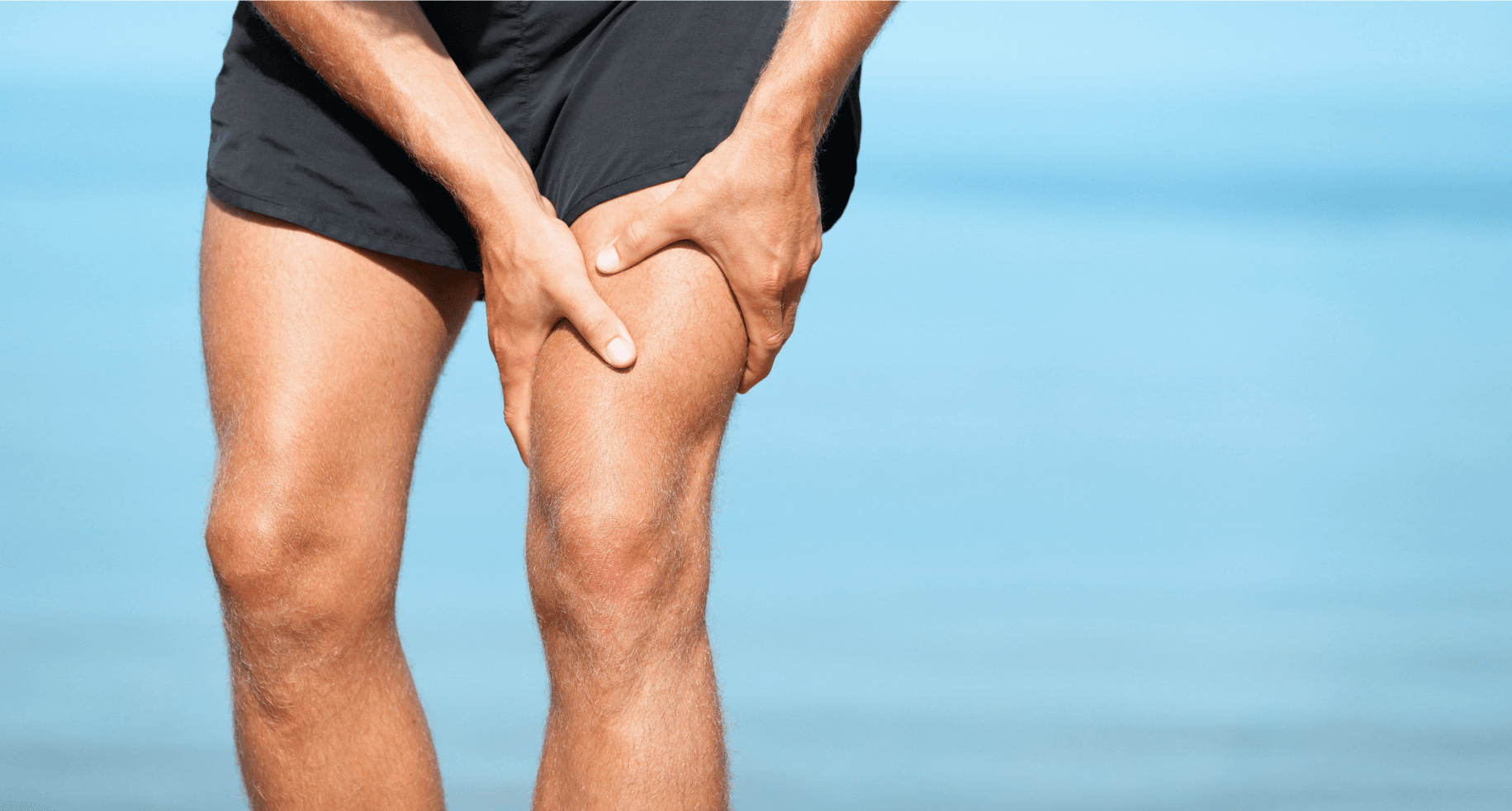 Runner massages sore muscle
